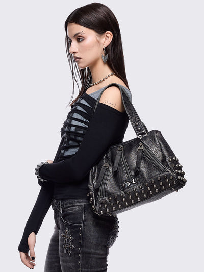 Black faux leather shoulder bag featuring stud and metal hardware details.