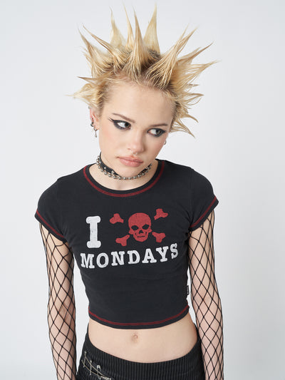  A black baby tee with the "I Hate Mondays" statement, perfect for expressing your Monday in style.
