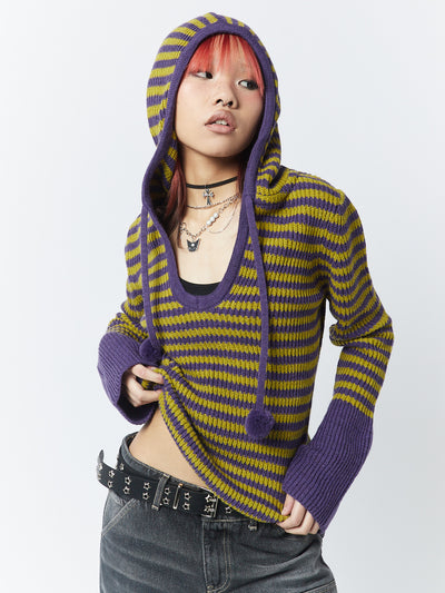 A knitted hoodie named Paige in a vibrant yellow and purple color combination by Minga London. This hoodie offers a cozy and stylish option, with its colorful knit and comfortable design perfect for adding a pop of color to your wardrobe.