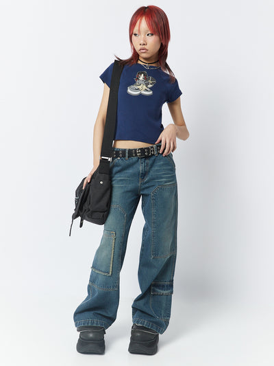  A blue baby tee with a skater girl graphic, showcasing a cool and playful design for an effortlessly stylish look.