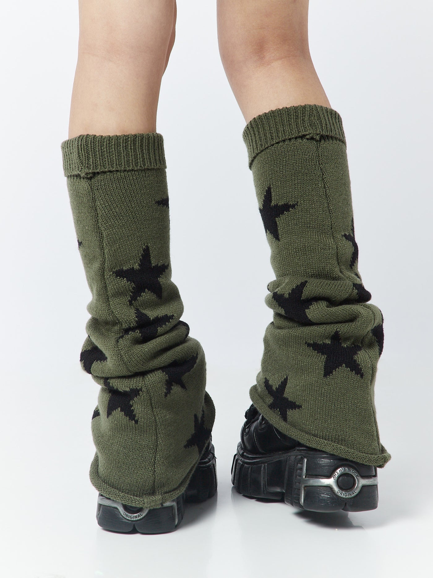 Flare leg warmers with star accents by Minga London, adding a touch of celestial charm to your outfit while keeping your legs cozy and stylish.