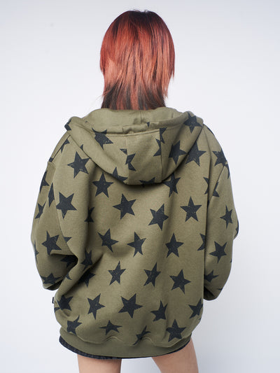  Green zip-up hoodie with stars print, combining comfort and style for a trendy and versatile look.