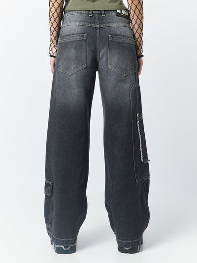 Black overdye cargo jeans named Track by Minga London. These jeans feature multiple pockets, adding a touch of utility and style to your casual outfit.