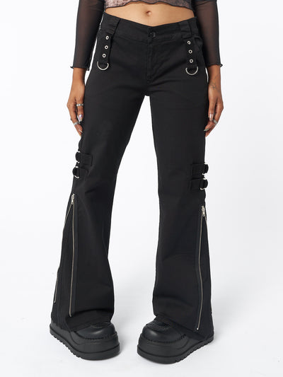 Side zip flare trousers in black with grommet eyelet strip and D-ring details