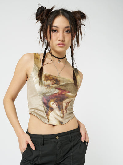 Gold velvet corset crop top named Alpine by Minga London, featuring a flattering silhouette and soft velvet fabric for a stylish and trendy look.