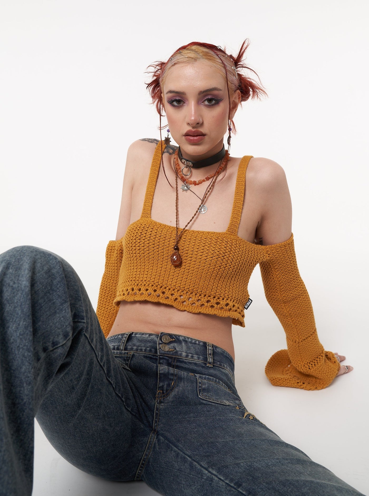 Knitted crop top in golden yellow with flared long sleeves