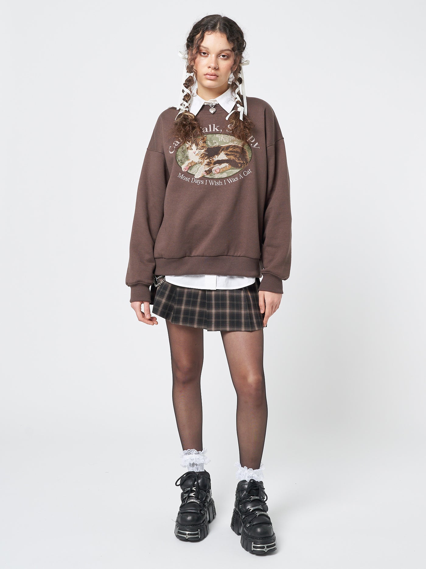 A cozy sweatshirt featuring an adorable "Can't Talk, Sleepy" cat embroidery, perfect for cat enthusiasts.