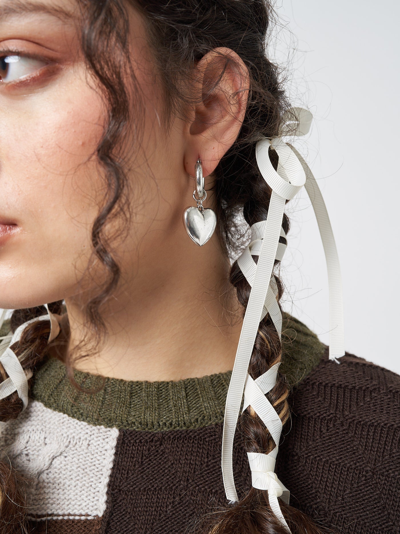 Stylish and statement-making earrings featuring chunky heart-shaped hoops for a bold and trendy look.