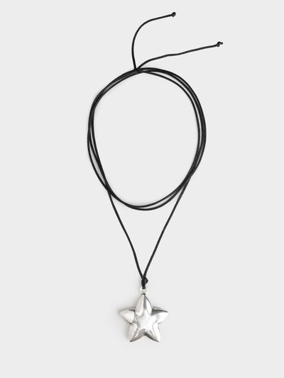 This chunky pendant necklace features a star design, adding a touch of celestial charm to your look. The bold and eye-catching pendant hangs from a sturdy chain, making it a stylish statement accessory for any outfit.