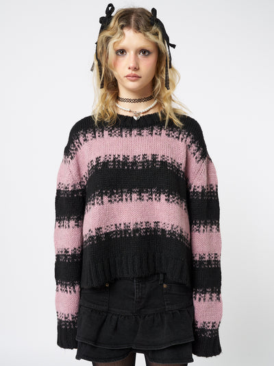 A trendy and stylish pink and black striped cropped knit sweater.