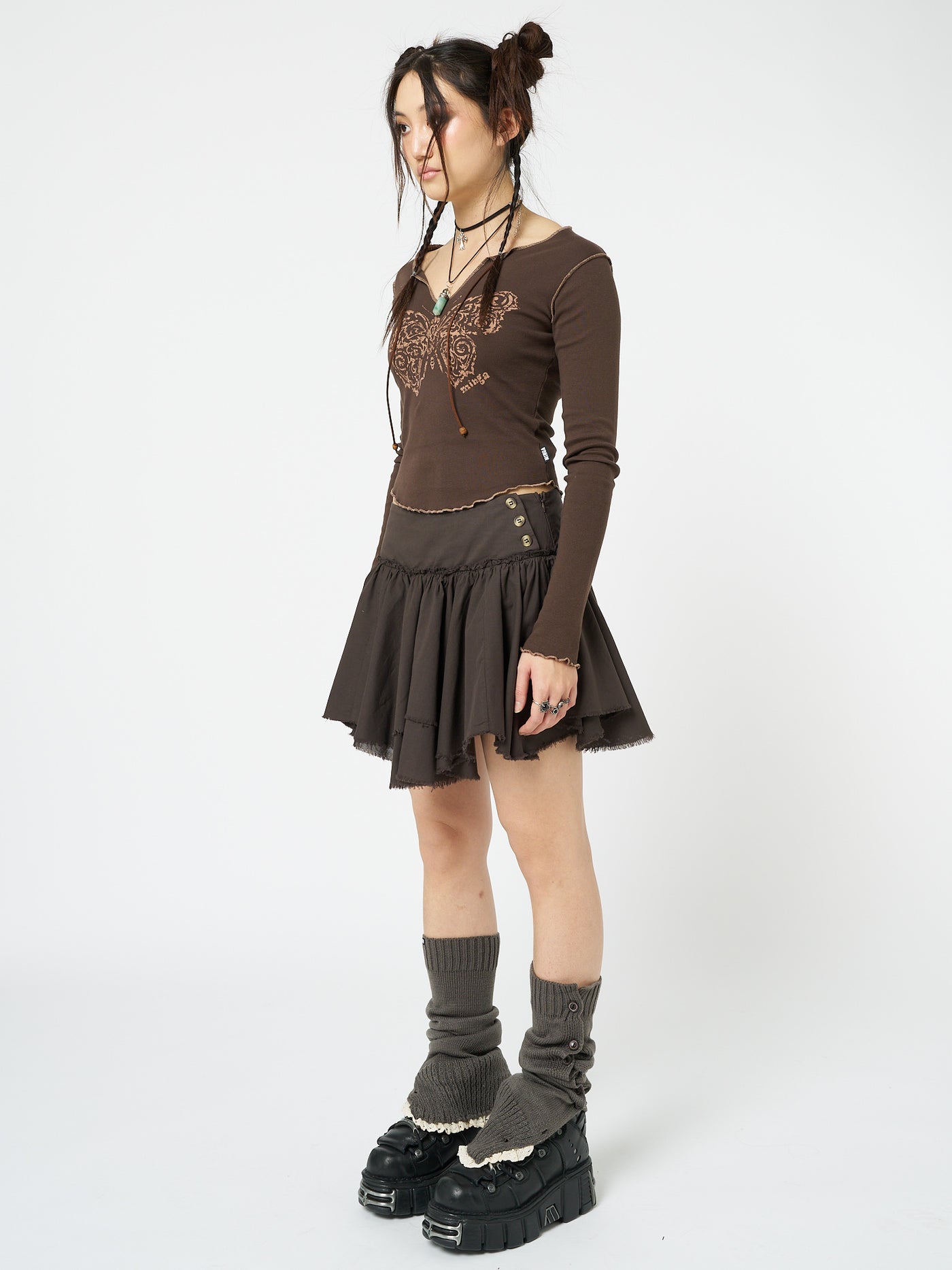 Embrace fairycore fashion with this brown layered asymmetrical mini skirt, adding enchanting vibes to your look.