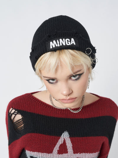 A stylish and edgy black beanie with distressed details for a rugged and trendy look.