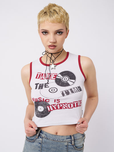 A music-inspired graphic print vest top by Minga London. The top showcases a mesmerizing design with contrast trims in red, adding a vibrant and dynamic touch to your outfit.