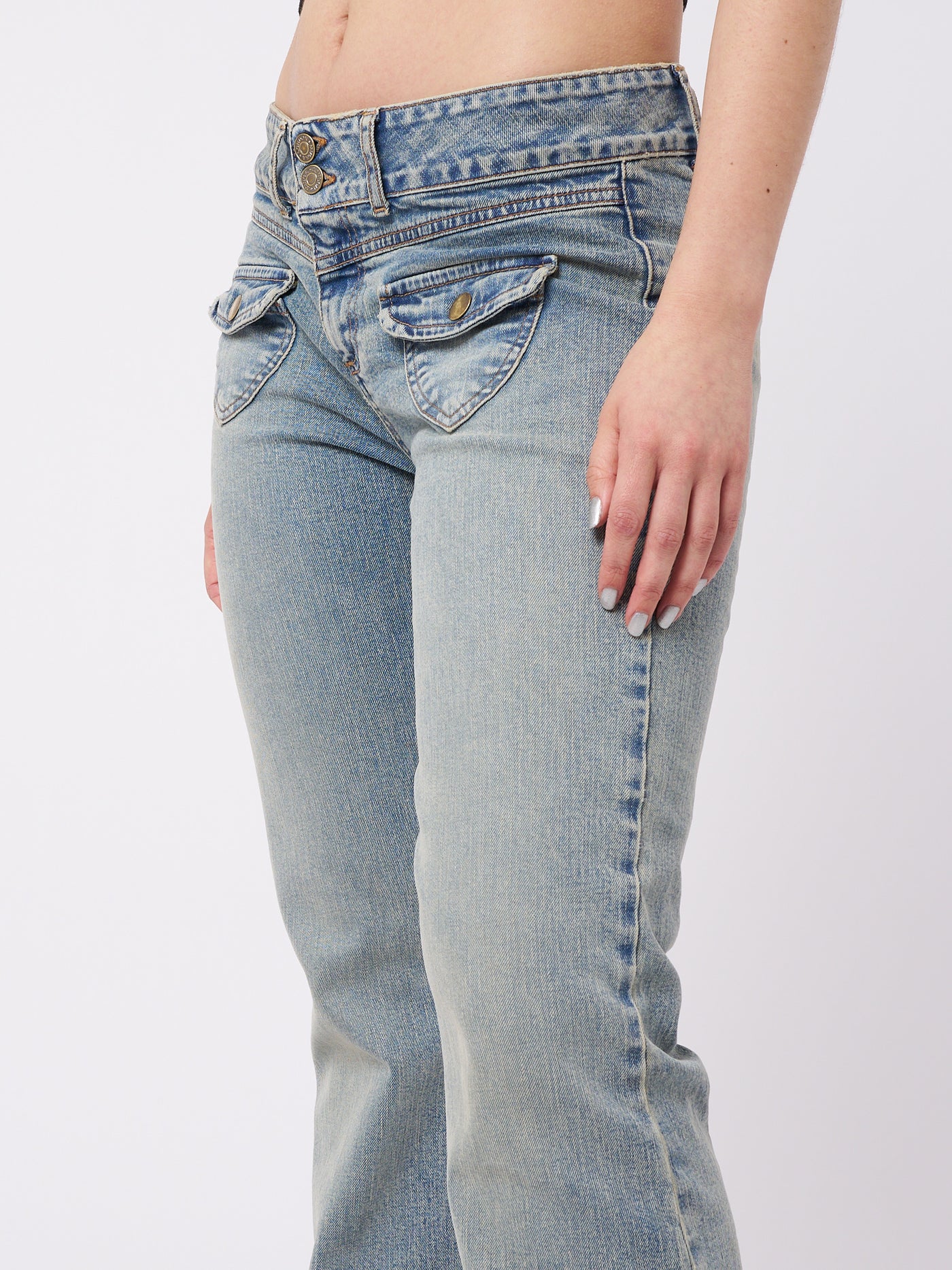 Over-dyed flare jeans with front pockets by Minga London. Trendy and flattering fit for a fashionable and retro-inspired look.