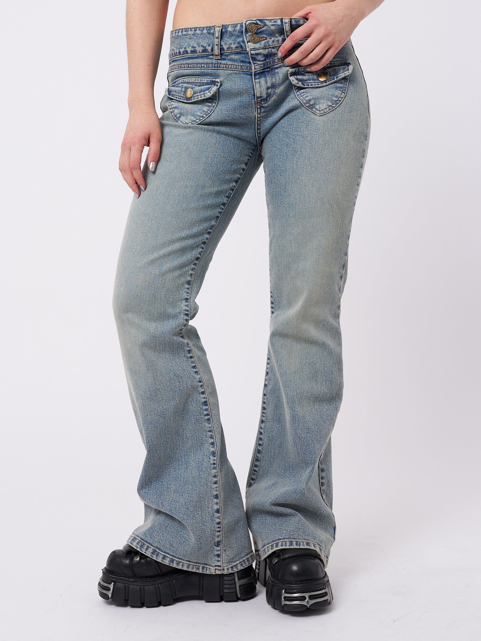 Over-dyed flare jeans with front pockets by Minga London. Trendy and flattering fit for a fashionable and retro-inspired look.