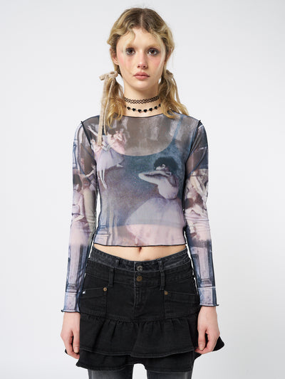  A captivating long sleeve mesh top with an enchanting graphic design.