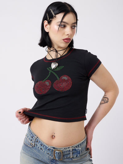 Rhinestone-adorned Mon Cheri baby tee by Minga London. Cute top for adding a touch of sparkle to your outfit.