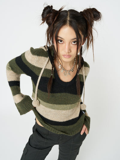 Stay cozy and stylish in this striped knitted hoodie with a touch of earthy charm.