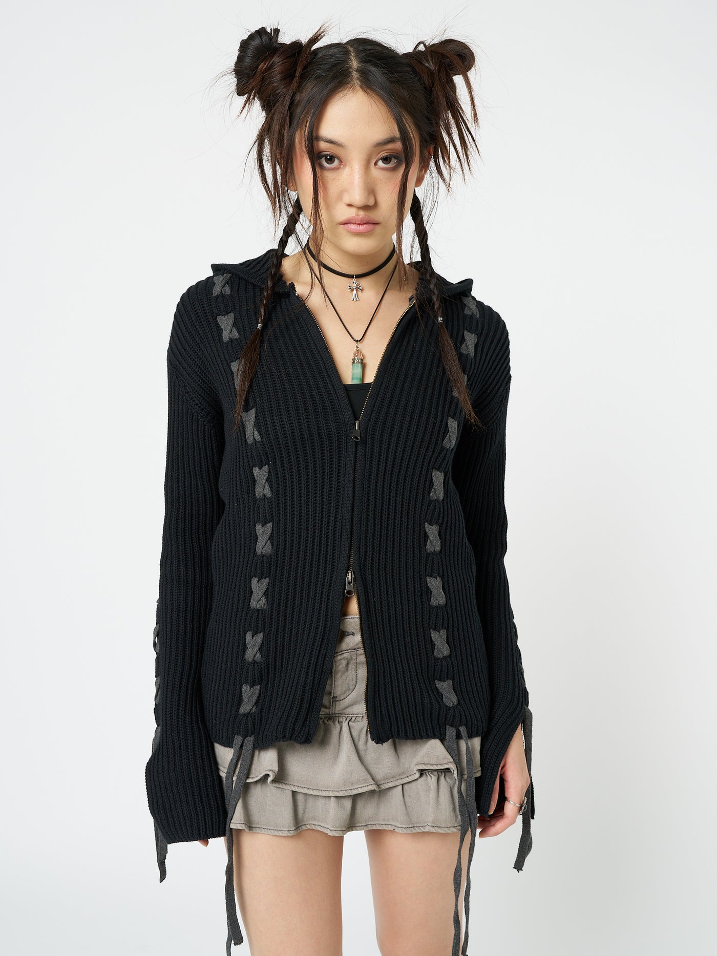 This black lace-up hoodie cardigan combines comfort and style effortlessly. The lace-up detailing adds a trendy touch to the classic hoodie design, making it a versatile and fashionable piece for any casual outfit.
