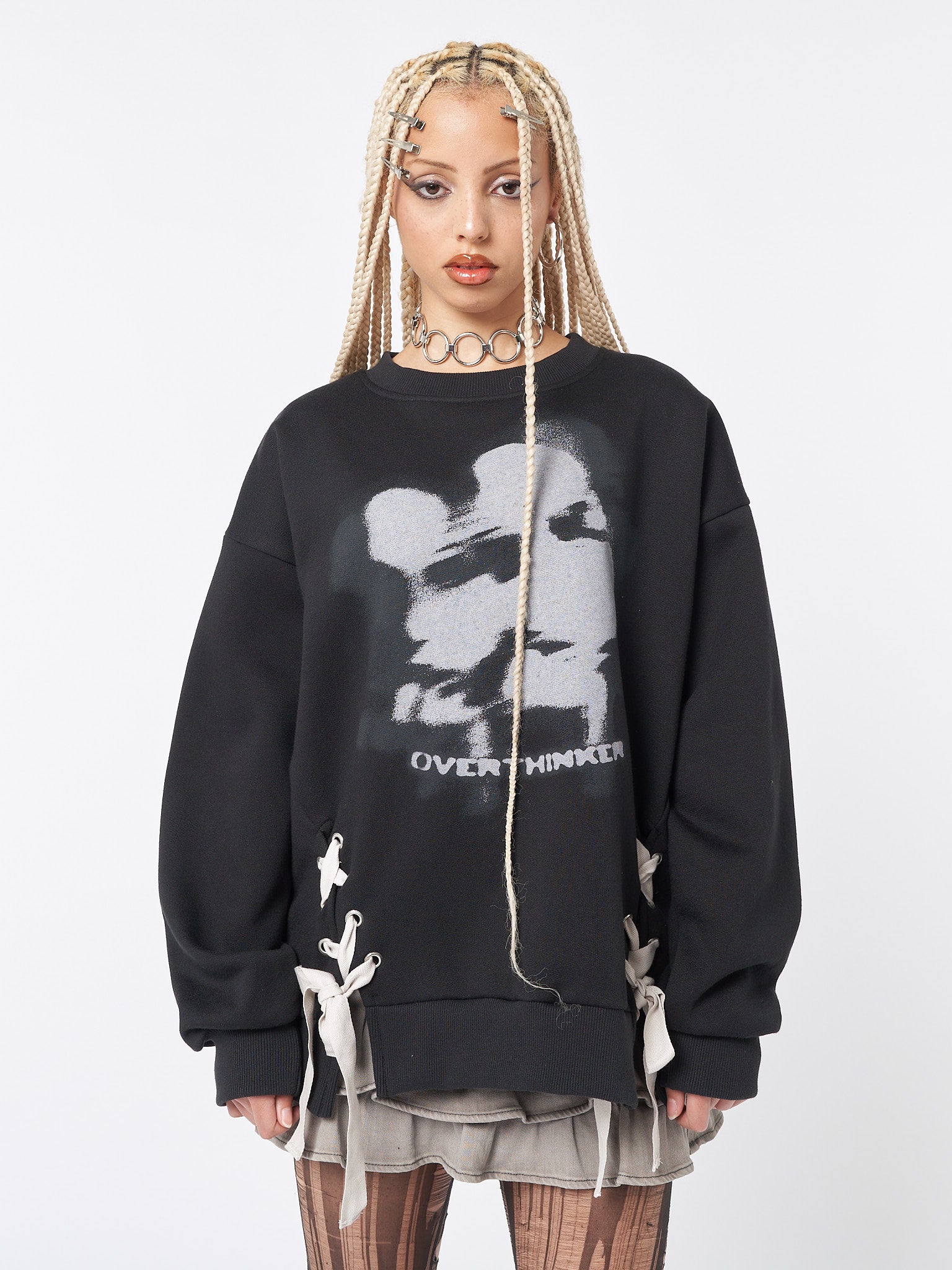 Relaxed sweatshirt in black with contrast lace up details and "Overthinker" graphic screen print