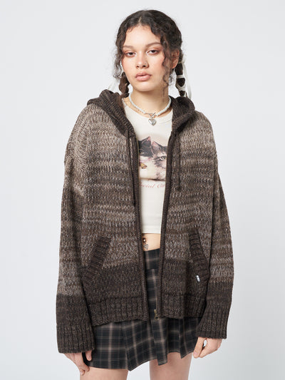 A warm and stylish degrade brown knit cardigan with a zip-up front and hood, perfect for cozy days.