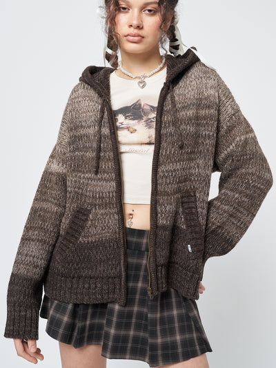 A warm and stylish degrade brown knit cardigan with a zip-up front and hood, perfect for cozy days.