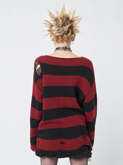 Embrace your dark side with this black and red striped knit jumper featuring distressed details and a prominent pentagram star motif.