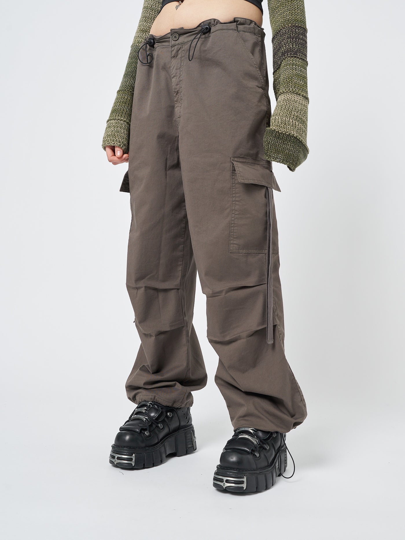 Stylish and functional cargo pants in a versatile brown color, perfect for a tech-inspired look.
