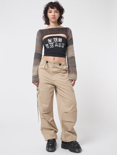 Beige tech cargo pants in parachute style with side utility pockets