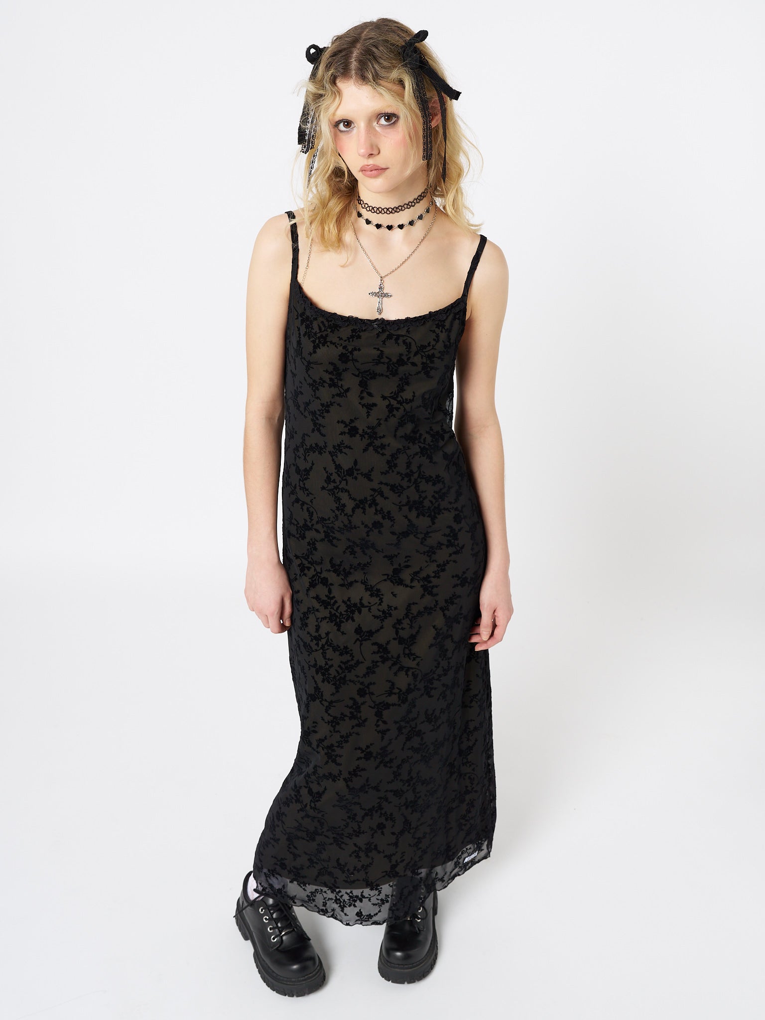 Embrace an ethereal allure with this enchanting black mesh maxi dress adorned with a velvet floral print.