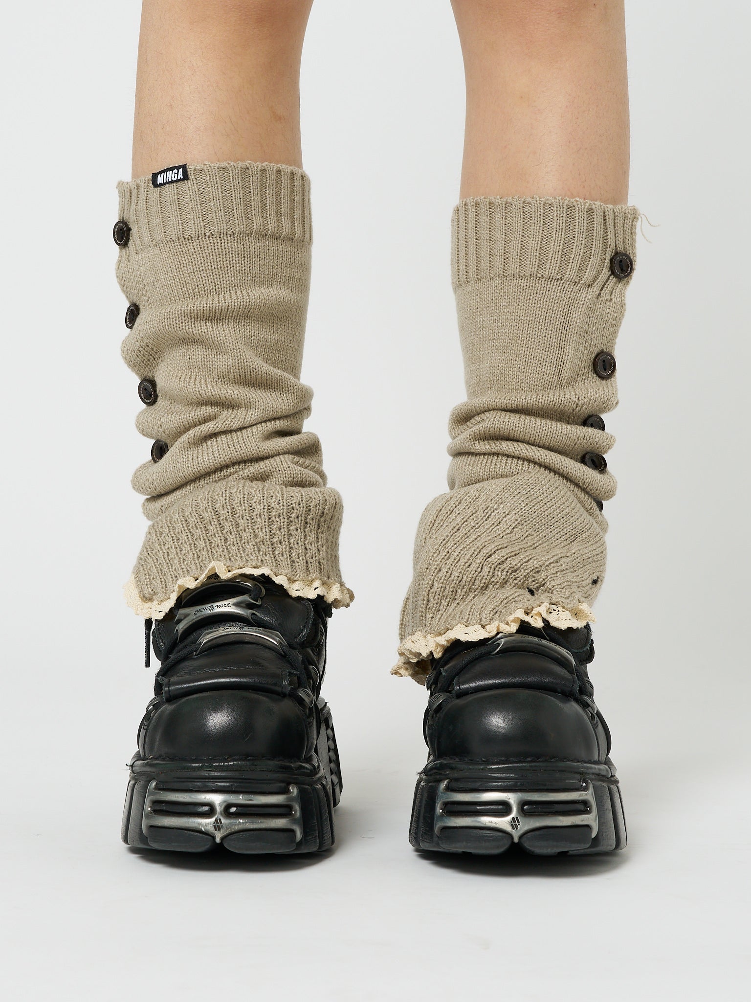 Beige leg warmers named Zeva by Minga London, featuring button details for a stylish and cozy addition to your wardrobe.