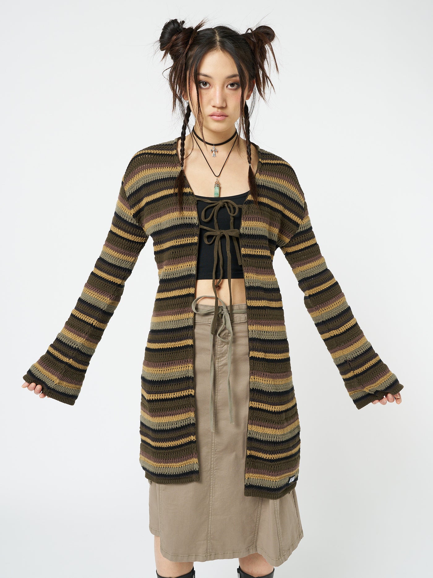 Embrace nature-inspired style with this forest striped knit cardigan featuring a trendy tie front detail.