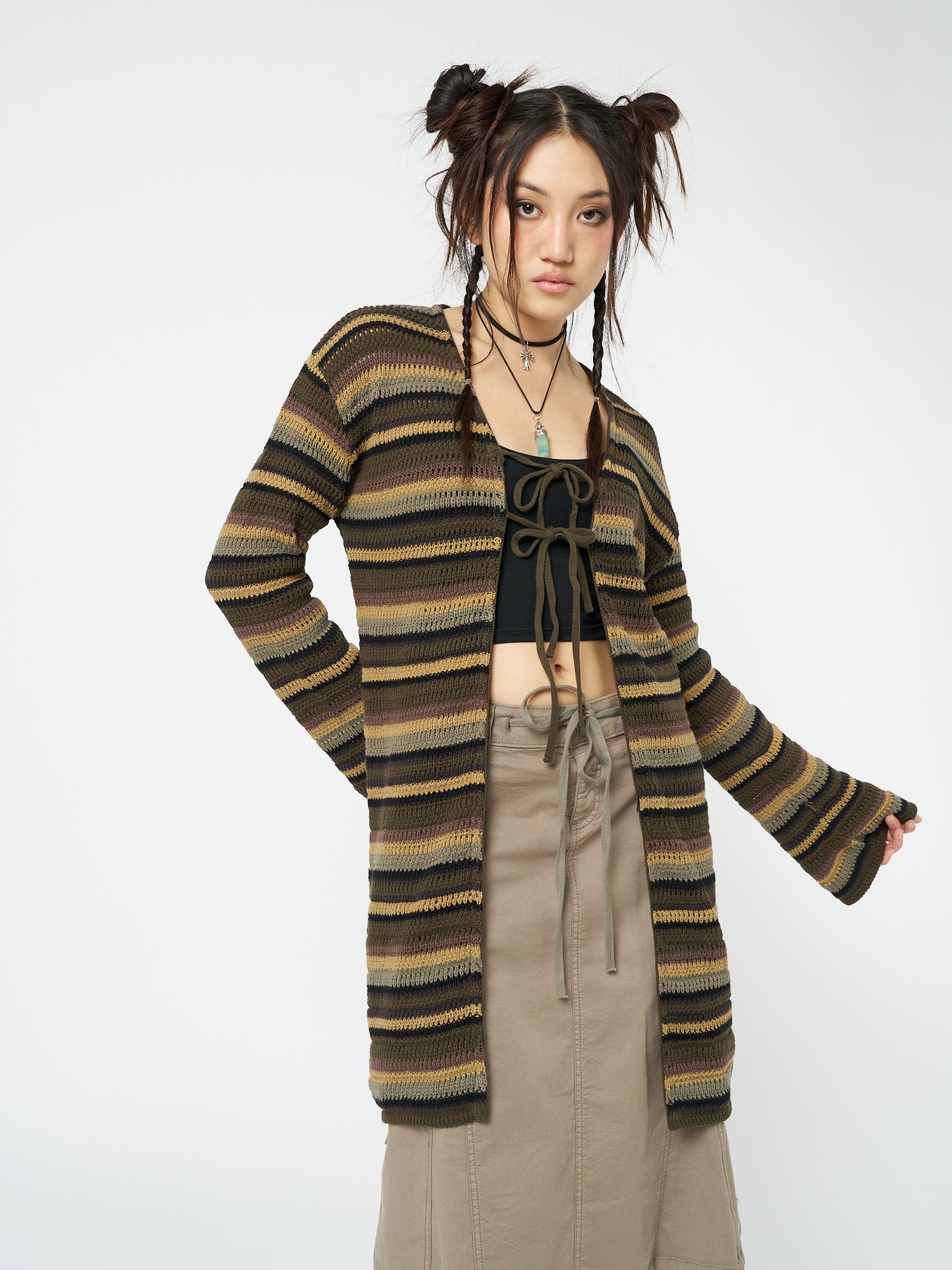 Embrace nature-inspired style with this forest striped knit cardigan featuring a trendy tie front detail.