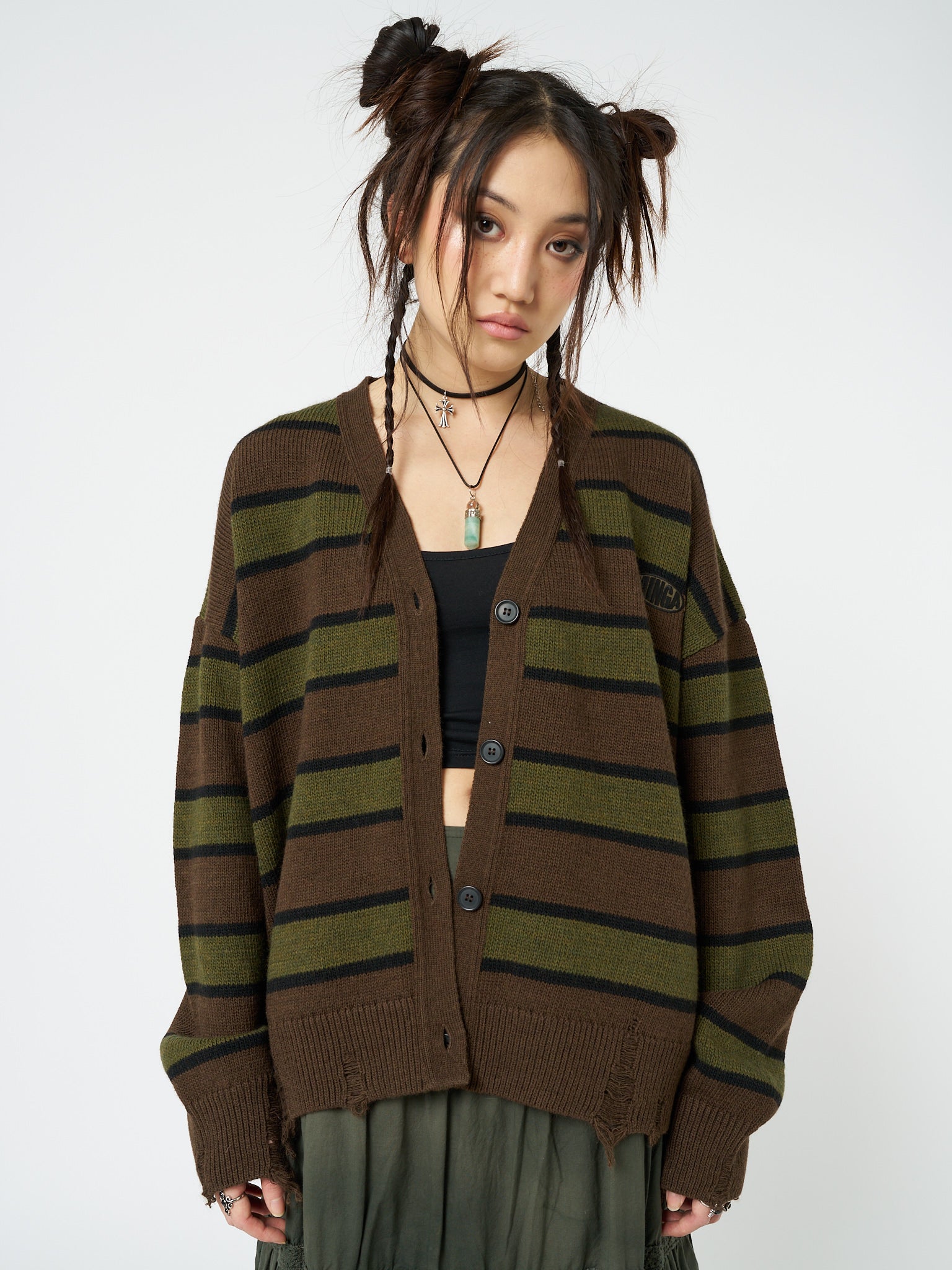 Relaxed fit knit cardigan named Neesa by Minga London, with brown and green stripes, providing a comfortable and stylish option for your casual outfits.